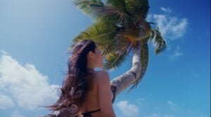 Beautiful Tonga girl next to a coconut tree in Tonga