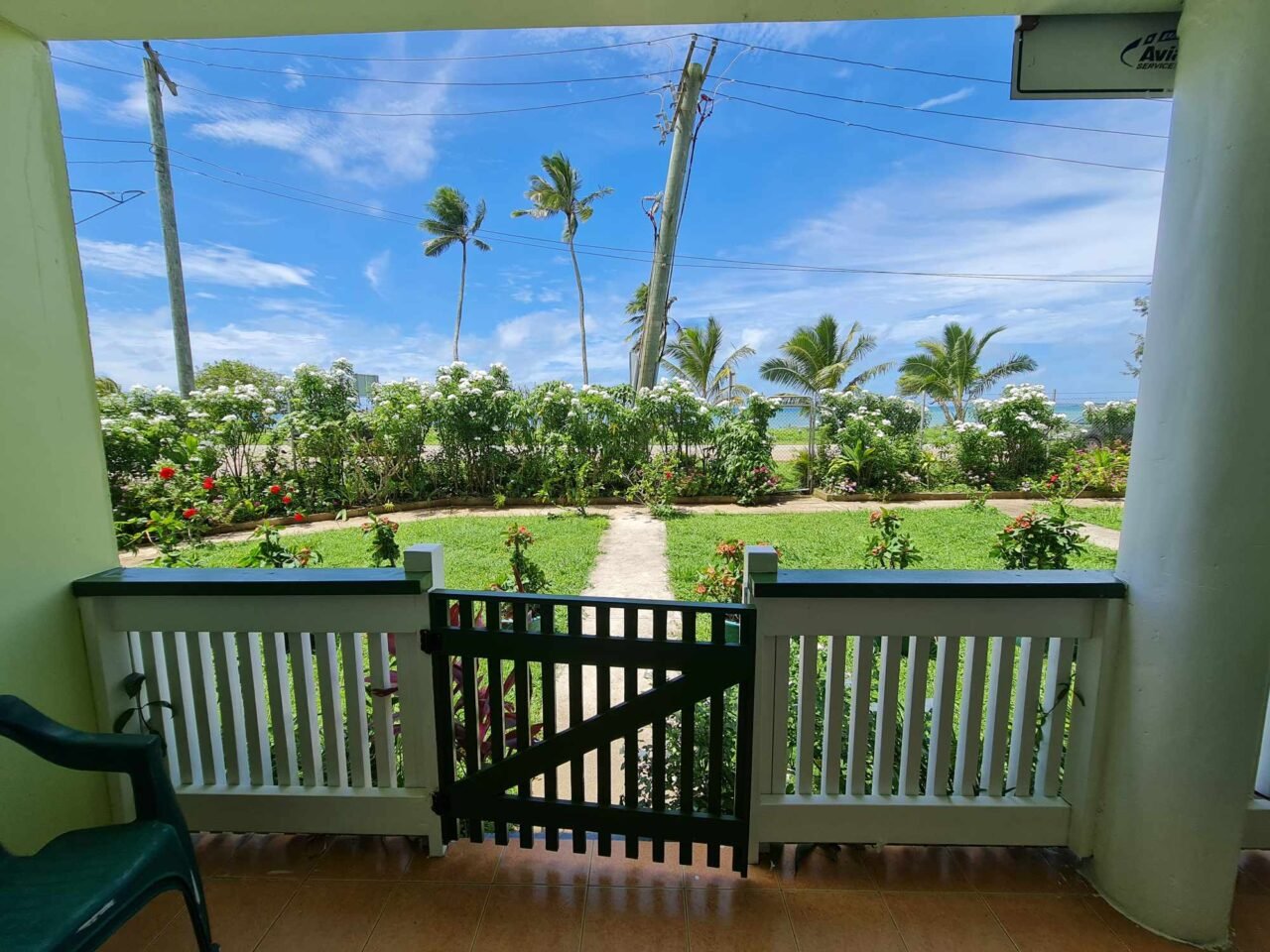 View of the beautiful garden and ocean view from Sky Lodge apartment